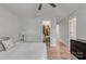 Bedroom features a ceiling fan, neutral-toned walls, and a view into a walk-in closet at 1522 Stafford Ext, Monroe, NC 28110