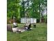 Cozy backyard retreat with a charming fire pit area and lush green surroundings at 1623 Mulberry Cir, Rock Hill, SC 29730
