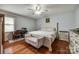 Serene bedroom with hardwood floors, a ceiling fan, and neutral decor at 1623 Mulberry Cir, Rock Hill, SC 29730