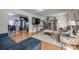 Open-concept living room with hardwood floors, comfortable seating, and access to the kitchen at 1623 Mulberry Cir, Rock Hill, SC 29730