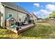 Spacious backyard with a deck, a playhouse, and a grassy lawn, perfect for Gathering fun and entertainment at 1688 Avalon Dr, Rock Hill, SC 29730