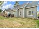 The backyard features a multi-level deck and green space perfect for outdoor enjoyment at 1688 Avalon Dr, Rock Hill, SC 29730