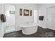 Bathroom shows a soaking tub between the glass shower and the doorway at 1688 Avalon Dr, Rock Hill, SC 29730