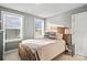 Bedroom featuring two windows, desk, lamp, and light colored walls at 1688 Avalon Dr, Rock Hill, SC 29730