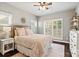 Bedroom with a large window, a bed with patterned linens, and neutral walls at 1688 Avalon Dr, Rock Hill, SC 29730