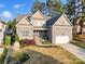 Inviting home with stone accents, attached garage, and well-maintained landscaping creating curb appeal at 1688 Avalon Dr, Rock Hill, SC 29730
