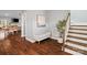 Inviting foyer features hardwood floors, a staircase, and a glimpse of the open-concept living space beyond at 1688 Avalon Dr, Rock Hill, SC 29730