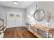 Bright foyer with hardwood floors, double front doors, console table, and staircase, creating a welcoming entrance at 1688 Avalon Dr, Rock Hill, SC 29730