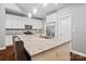 Modern kitchen featuring a large island with bar seating and granite countertops, stainless steel refrigerator at 1688 Avalon Dr, Rock Hill, SC 29730