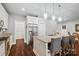 Open kitchen design with granite countertops, stainless steel appliances, eat in island and hardwood flooring at 1688 Avalon Dr, Rock Hill, SC 29730