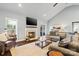 Bright and airy living room with a fireplace, large windows, hardwood floors and comfortable seating at 1688 Avalon Dr, Rock Hill, SC 29730