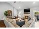 Spacious living room with vaulted ceilings, fireplace and large sectional sofa and hardwood floors at 1688 Avalon Dr, Rock Hill, SC 29730