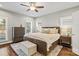 Comfortable main bedroom with hardwood floors, a ceiling fan, neutral décor, and bright windows at 1688 Avalon Dr, Rock Hill, SC 29730