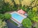 Aerial view of the community pool and surrounding lounge area, nestled in mature trees at 1688 Avalon Dr, Rock Hill, SC 29730