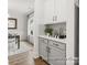 Chic butler's pantry with gray lower cabinets, white upper cabinets, and stylish countertop decor at 181 Montgomery Pl # 726, Mount Gilead, NC 27306