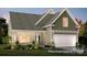 Charming single-Gathering home with a two-car garage, landscaped front yard and Craftsman-style architectural details at 181 Montgomery Pl # 726, Mount Gilead, NC 27306