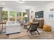 Spacious living room with large windows, contemporary decor, and comfortable seating arrangements at 181 Montgomery Pl # 726, Mount Gilead, NC 27306