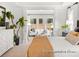 Bright main bedroom with large windows and view into a sitting area, featuring neutral decor at 181 Montgomery Pl # 726, Mount Gilead, NC 27306