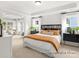 Serene main bedroom featuring lots of natural light, neutral tones, and a view into a sitting area at 181 Montgomery Pl # 726, Mount Gilead, NC 27306