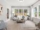 Cozy sitting area featuring a white sofa and lots of light, with a view of the surrounding landscape at 181 Montgomery Pl # 726, Mount Gilead, NC 27306