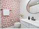 Charming powder room with unique wallpaper and modern fixtures at 1849 Fleetwood Dr, Charlotte, NC 28208