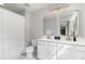 Well-lit bathroom with double sinks, modern fixtures, and a shower-tub combination at 1849 Fleetwood Dr, Charlotte, NC 28208