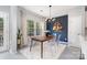 Dining area features modern lighting, large windows, and stylish decor at 1849 Fleetwood Dr, Charlotte, NC 28208