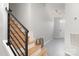 Open and airy hallway with stairs and tile flooring at 1849 Fleetwood Dr, Charlotte, NC 28208
