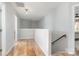 Bright hallway with hardwood floors and access to multiple rooms at 1849 Fleetwood Dr, Charlotte, NC 28208