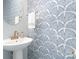 Stylish powder room with a unique wallpaper and a round mirror at 1849 Fleetwood Dr, Charlotte, NC 28208