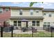 Exterior rear view featuring a patio area with seating and backyard with grass, fenced in at 1849 Fleetwood Dr, Charlotte, NC 28208