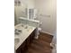 Full bathroom with double sink vanity, wood cabinets, and modern fixtures at 1863 New Castle Dr, Fort Mill, SC 29707