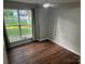 Bright bedroom with hardwood floors, neutral walls, and a large window with outdoor views at 1863 New Castle Dr, Fort Mill, SC 29707