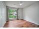 Bright bedroom with wood floors, large window, and ample natural light at 1863 New Castle Dr, Fort Mill, SC 29707