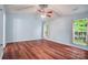 Bright bedroom with wood floors, vaulted ceilings, ceiling fan, and dual windows at 1863 New Castle Dr, Fort Mill, SC 29707