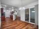Bright dining area with chandelier and sliding door to screened porch at 1863 New Castle Dr, Fort Mill, SC 29707