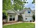 Charming single-story home with vinyl siding, an attached garage, and a well-maintained lawn at 1863 New Castle Dr, Fort Mill, SC 29707