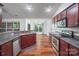 Kitchen features granite countertops, stainless appliances and a window view to dining area at 1863 New Castle Dr, Fort Mill, SC 29707
