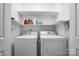 Laundry room featuring a washer, dryer, and storage shelves at 1863 New Castle Dr, Fort Mill, SC 29707