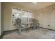 This covered patio features two gray chairs and a small table to provide a nice place to relax and look out over the yard at 1863 New Castle Dr, Fort Mill, SC 29707