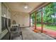 Enclosed back porch with ceiling fan, a sitting area, and access to the backyard at 1863 New Castle Dr, Fort Mill, SC 29707