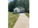 Charming home exterior with a welcoming front porch and well-manicured landscaping at 1889 Oak Hollow Rd, Gastonia, NC 28054
