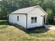 Back view of home highlighting vinyl siding and level backyard at 1889 Oak Hollow Rd, Gastonia, NC 28054