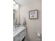 Chic powder room featuring a stylish vanity with marble countertop, modern fixtures, and tasteful decor at 1988 Clear Brooke Dr, Kannapolis, NC 28083