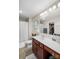 Neutral bathroom with shower, tile floor, and cherry vanity with white sink at 1988 Clear Brooke Dr, Kannapolis, NC 28083