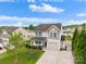 Charming two-story home with a well-manicured lawn, covered porch, and attached garage, perfect for Gathering living at 1988 Clear Brooke Dr, Kannapolis, NC 28083