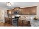 Kitchen boasts granite countertops, stainless steel appliances, and ample cabinet space at 1988 Clear Brooke Dr, Kannapolis, NC 28083