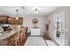 Bright kitchen boasts granite countertops, stainless steel appliances, and a charming breakfast bar with wooden stools at 1988 Clear Brooke Dr, Kannapolis, NC 28083