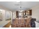 Kitchen features granite countertops, stainless appliances, and wood bar stools at 1988 Clear Brooke Dr, Kannapolis, NC 28083