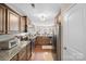 Well-equipped kitchen with granite countertops, stainless steel appliances, and hardwood floors at 1988 Clear Brooke Dr, Kannapolis, NC 28083